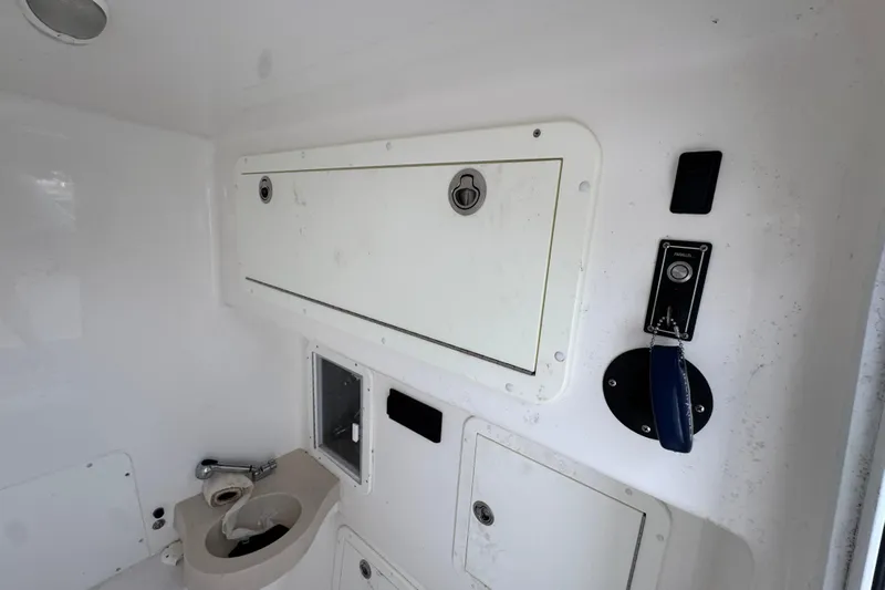  Yacht Photos Pics 2019 Invincible 39 Open Fisherman interior with storage compartments and control panel.