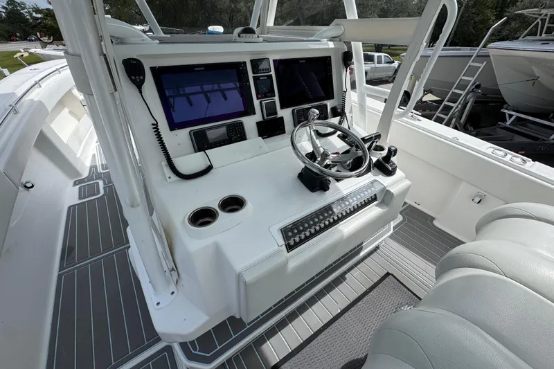  Yacht Photos Pics 2019 Invincible 39 Open Fisherman boat cockpit with modern controls and dual screens.