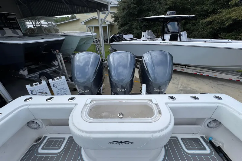  Yacht Photos Pics 2019 Invincible 39 Open Fisherman with triple 300 horsepower engines in a boatyard.