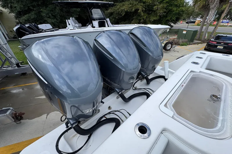 Yacht Photos Pics 2019 Invincible 39 Open Fisherman with triple Yamaha outboard engines, docked outdoors.