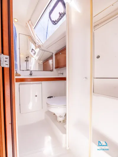  Yacht Photos Pics Beneteau Oceanis 46 2011 yacht bathroom with skylight and modern fixtures.