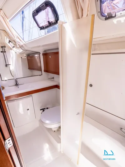  Yacht Photos Pics Interior of 2011 Beneteau Oceanis 46 yacht bathroom with modern fixtures and natural light.