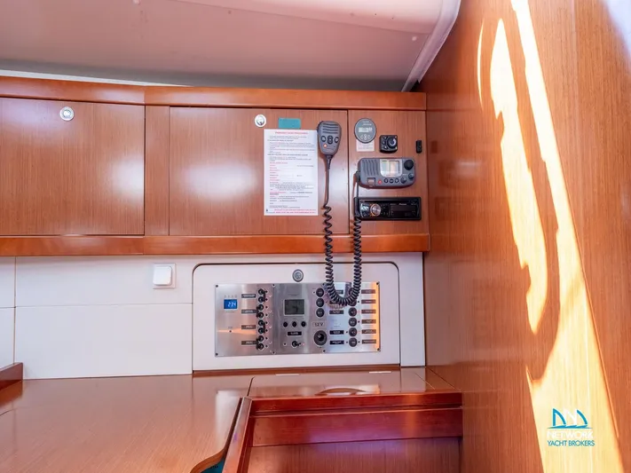  Yacht Photos Pics 2011 Beneteau Oceanis 46 yacht interior with control panel and communication equipment.