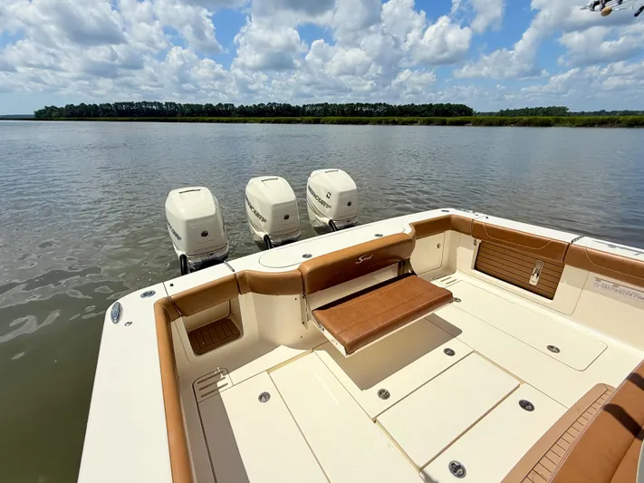 Wild Horses Yacht Photos Pics 2020 Scout 380 LXF boat with triple engines on a calm lake.