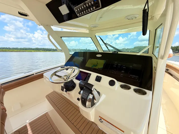 Wild Horses Yacht Photos Pics 2020 Scout 380 LXF boat helm with modern controls and scenic water view.