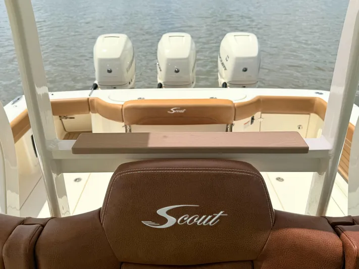 Wild Horses Yacht Photos Pics 2020 Scout 380 LXF boat interior with triple outboard engines on water.
