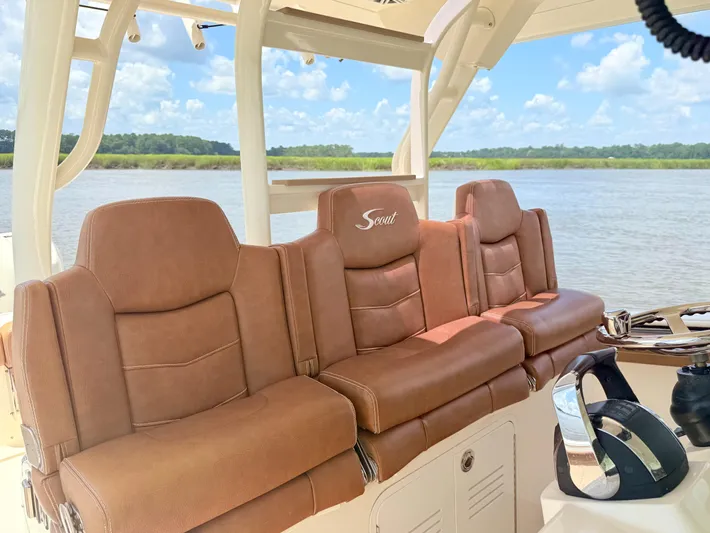 Wild Horses Yacht Photos Pics 2020 Scout 380 LXF boat with luxurious brown leather seating, scenic water view.