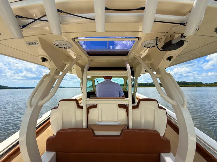 Wild Horses Yacht Photos Pics 2020 Scout 380 LXF boat interior with seating and water view.