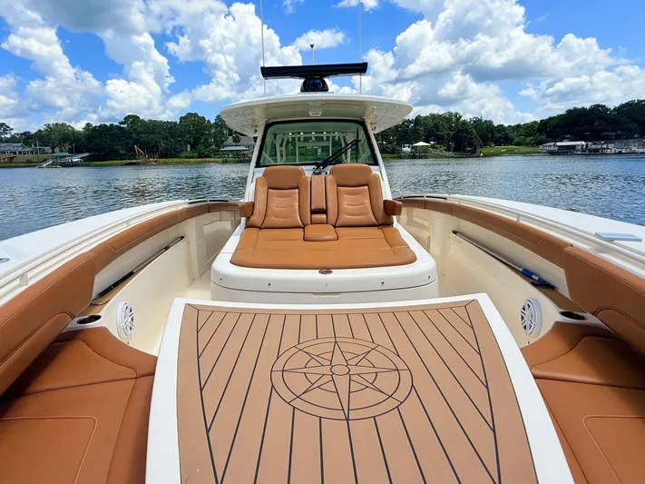 Wild Horses Yacht Photos Pics 2020 Scout 380 LXF boat with luxurious seating on a sunny day.