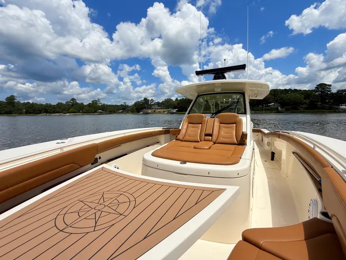 Wild Horses Yacht Photos Pics 2020 Scout 380 LXF boat with luxurious seating on a sunny day.