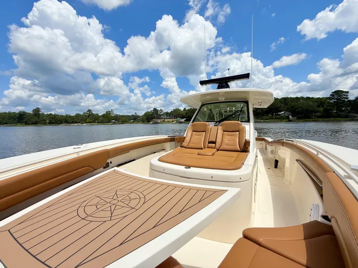 Wild Horses Yacht Photos Pics 2020 Scout 380 LXF boat with luxurious seating on a sunny day.