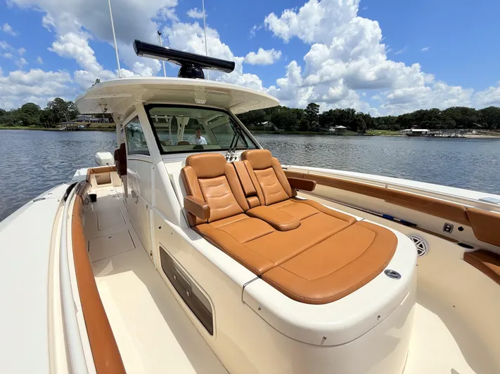 Wild Horses Yacht Photos Pics 2020 Scout 380 LXF boat with luxurious tan seating on a sunny day.