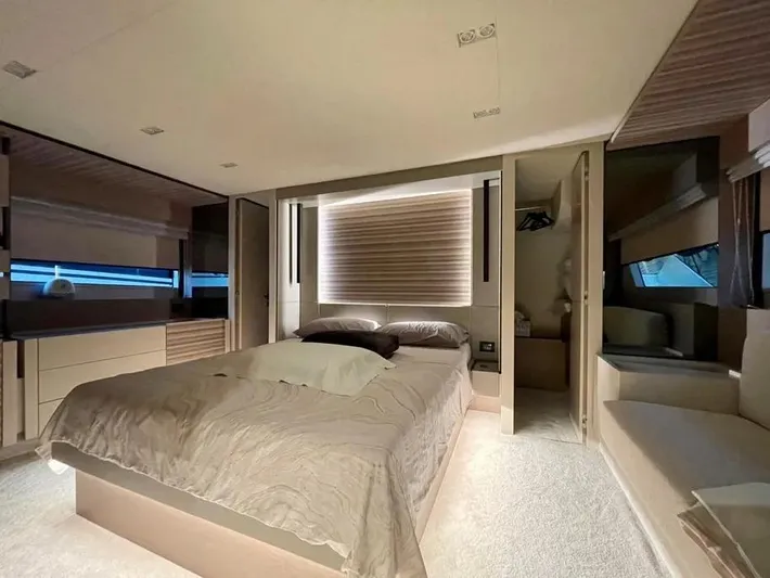 Yacht Photos Pics Luxurious bedroom interior of 2021 Ferretti Yachts 670, featuring modern design and elegant furnishings.