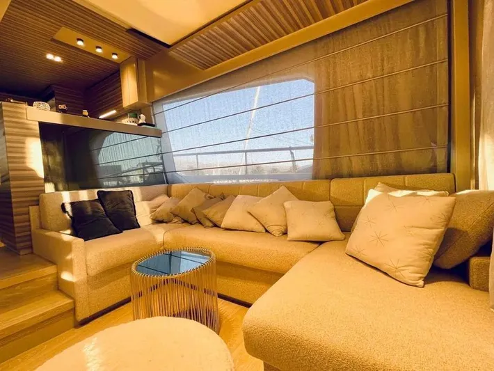  Yacht Photos Pics Luxurious interior of 2021 Ferretti Yachts 670 with plush seating and modern decor.