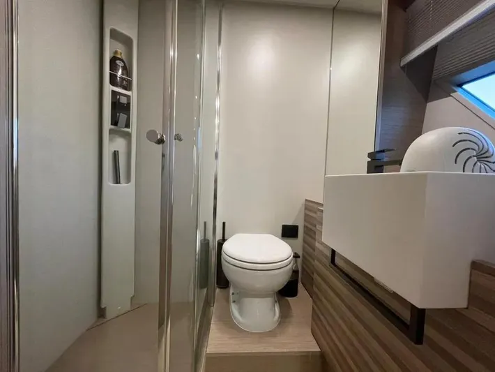  Yacht Photos Pics Luxurious bathroom in 2021 Ferretti Yachts 670, featuring modern fixtures and elegant design.