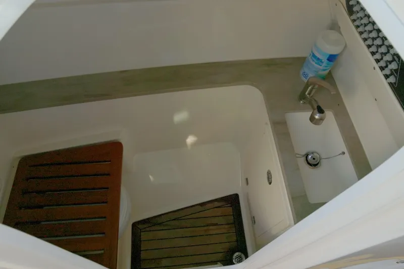  Yacht Photos Pics Interior view of 2023 Boston Whaler 320 Vantage boat's compact bathroom area.