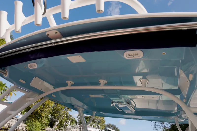  Yacht Photos Pics 2023 Boston Whaler 320 Vantage boat canopy, underside view with blue sky background.