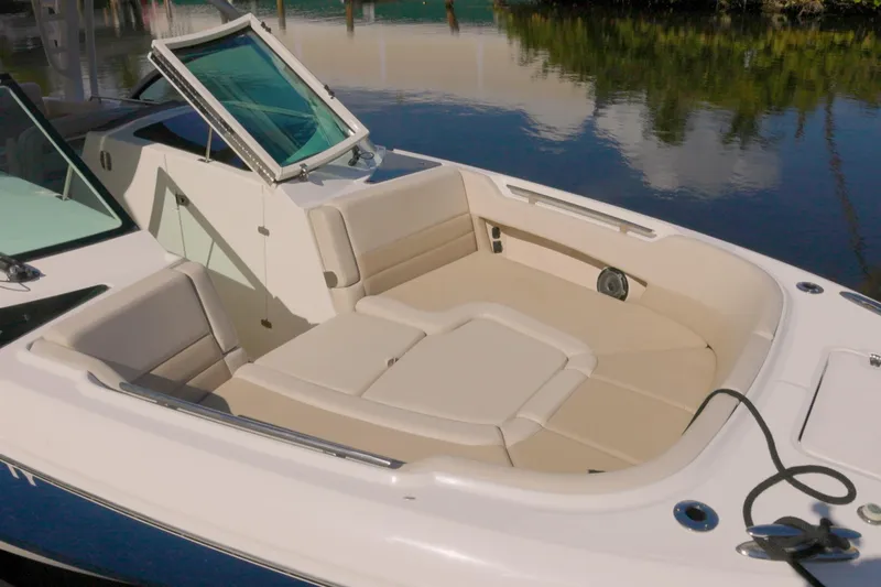  Yacht Photos Pics 2023 Boston Whaler 320 Vantage boat interior with beige seating and open hatch.