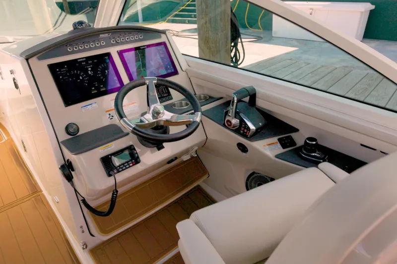  Yacht Photos Pics 2023 Boston Whaler 320 Vantage helm with modern controls and dual display screens.