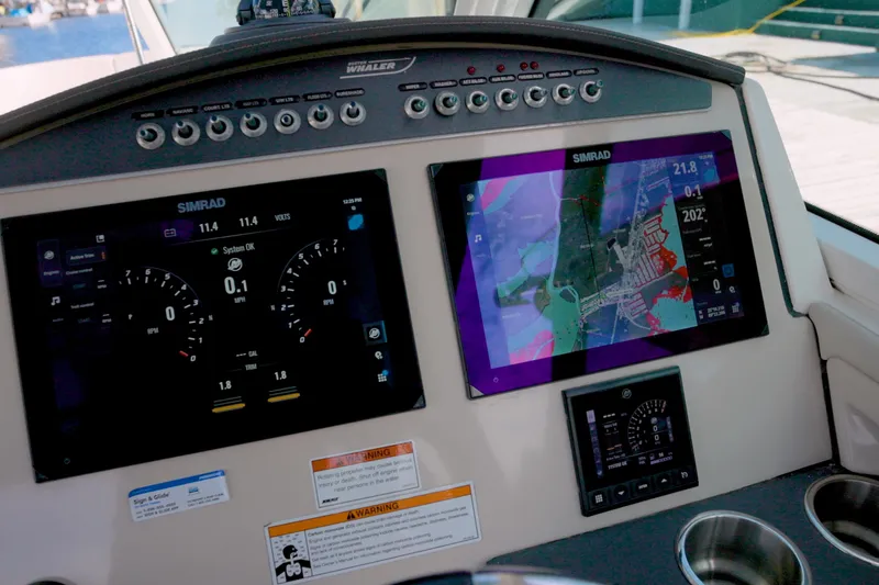  Yacht Photos Pics 2023 Boston Whaler 320 Vantage dashboard with Simrad navigation displays.