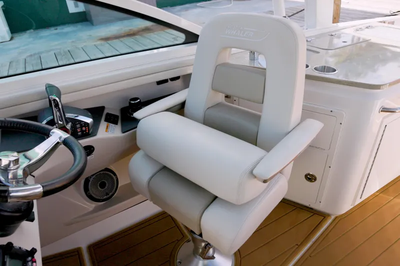 Yacht Photos Pics Captain's chair and helm of 2023 Boston Whaler 320 Vantage boat.