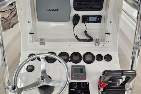 Control panel of 2003 Contender 27 Open boat with Garmin navigation system.
