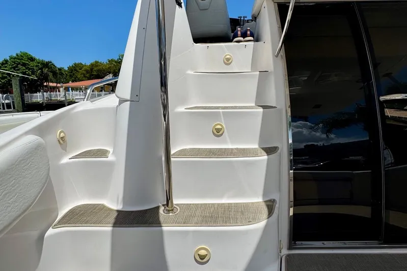 Santa Josefina Yacht Photos Pics Staircase on a 2009 Regal 4080 yacht, leading to upper deck.
