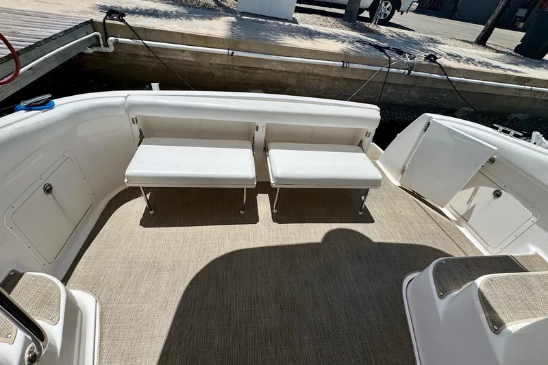 Santa Josefina Yacht Photos Pics Spacious deck of 2009 Regal 4080 boat with white seating and carpeted floor.