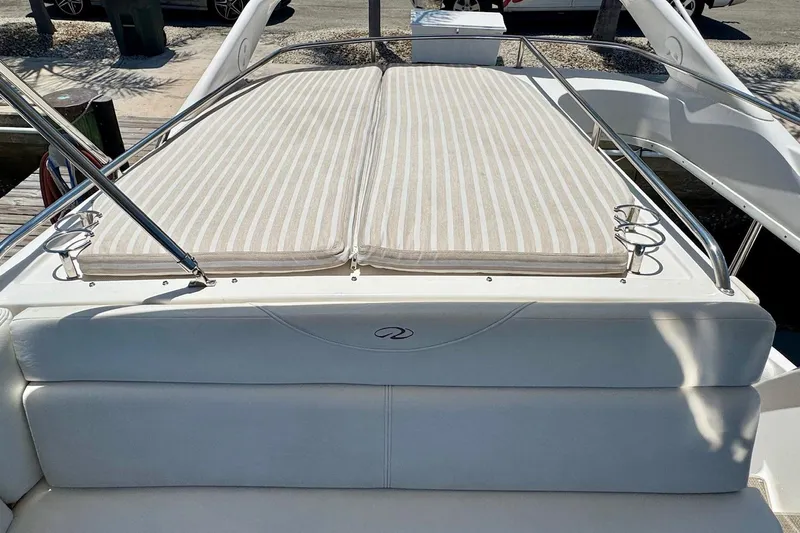 Santa Josefina Yacht Photos Pics Luxury 2009 Regal 4080 boat with cushioned sun deck and stainless steel railings.