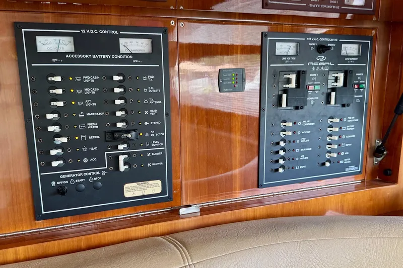 Santa Josefina Yacht Photos Pics Control panel of a 2009 Regal 4080 boat with various switches and gauges.