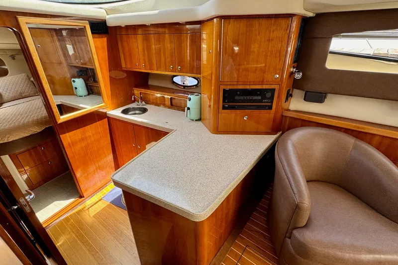 Santa Josefina Yacht Photos Pics Luxurious 2009 Regal 4080 yacht interior with wood cabinetry and modern amenities.