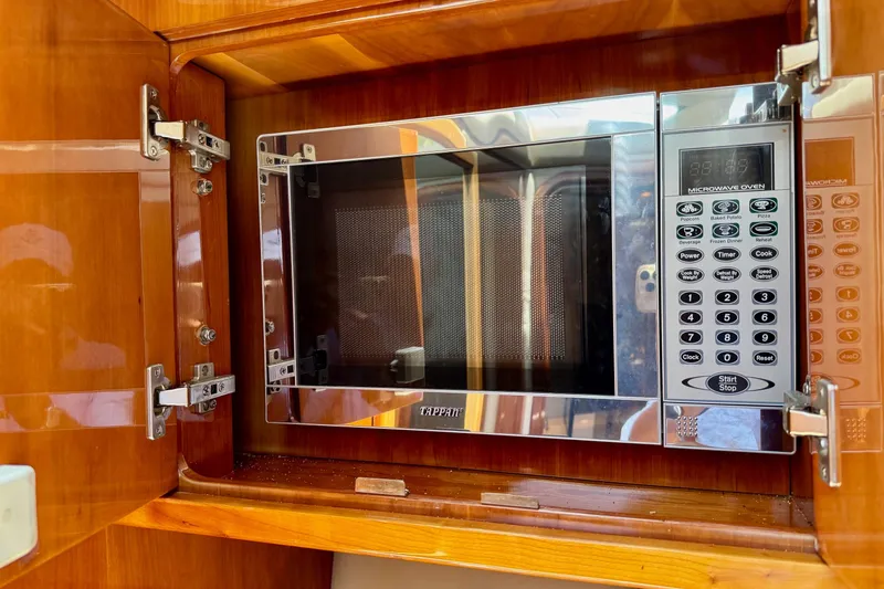 Santa Josefina Yacht Photos Pics Built-in microwave oven in a Regal 4080, 2009 model, with digital controls.