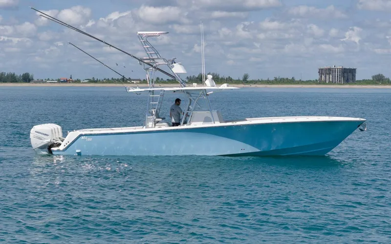  Yacht Photos Pics 2020 SeaVee 39 boat on calm ocean with clear sky and distant shoreline.