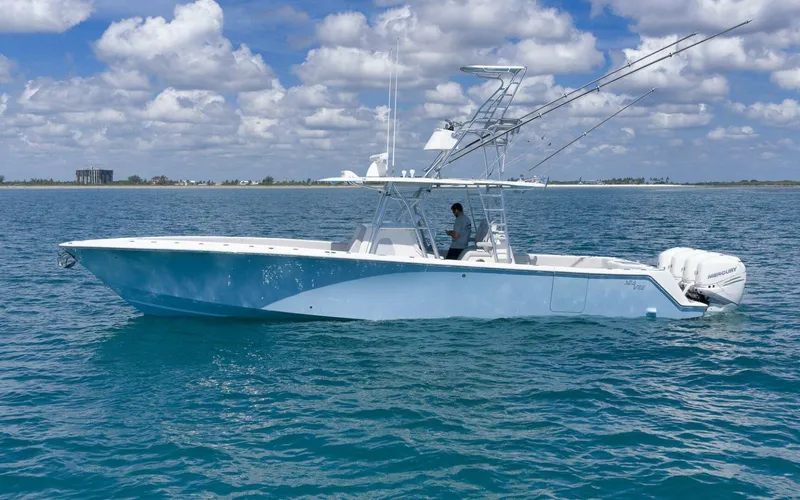  Yacht Photos Pics 2020 SeaVee 39 boat on calm ocean waters under a partly cloudy sky.