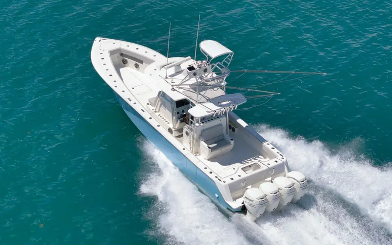  Yacht Photos Pics 2020 SeaVee 39 boat cruising on clear blue water, showcasing powerful engines.