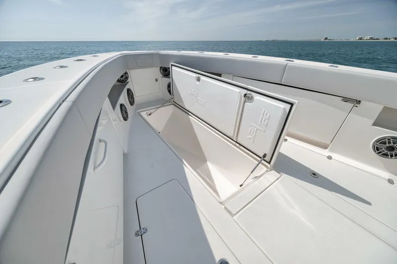  Yacht Photos Pics 2020 SeaVee 39 boat deck with open storage compartment, ocean view.