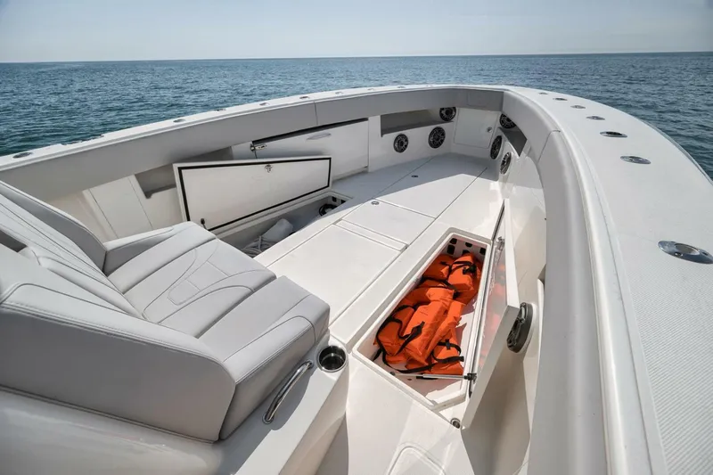  Yacht Photos Pics 2020 SeaVee 39 boat interior with seating, storage, and life jackets on open water.