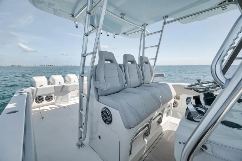  Yacht Photos Pics 2020 SeaVee 39 boat interior with seating and steering, on open water.