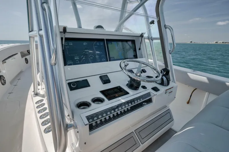  Yacht Photos Pics 2020 SeaVee 39 boat dashboard with modern navigation controls on open water.