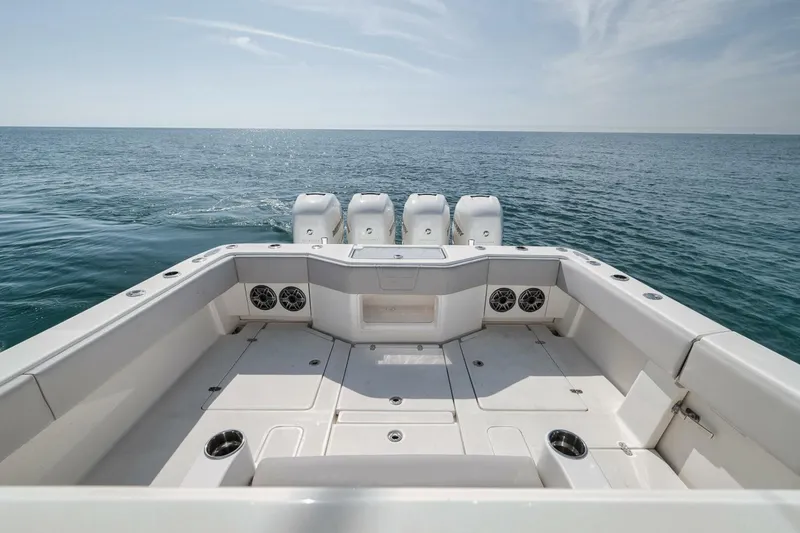  Yacht Photos Pics 2020 SeaVee 39 boat deck with quad engines, overlooking calm ocean waters.