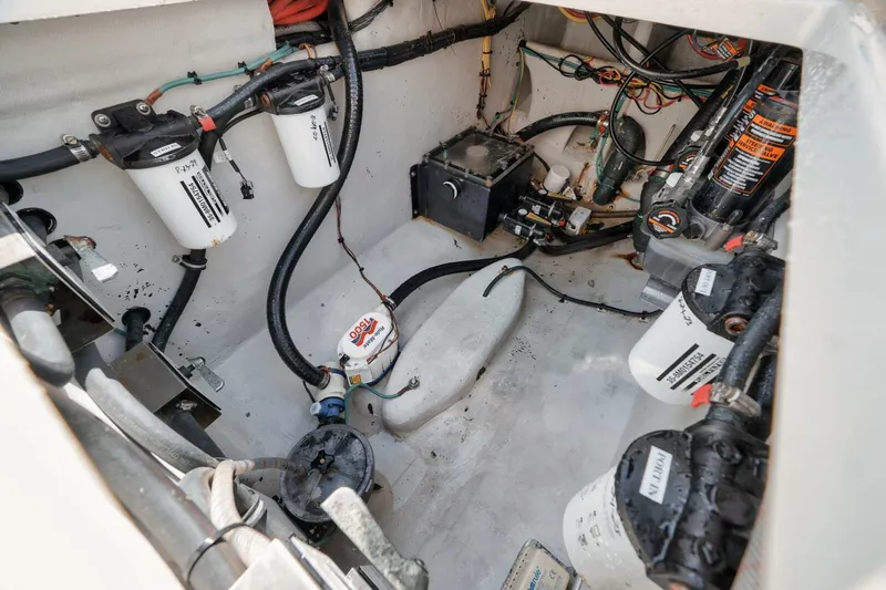  Yacht Photos Pics Engine compartment of a 2020 SeaVee 39 boat, showcasing filters and wiring.