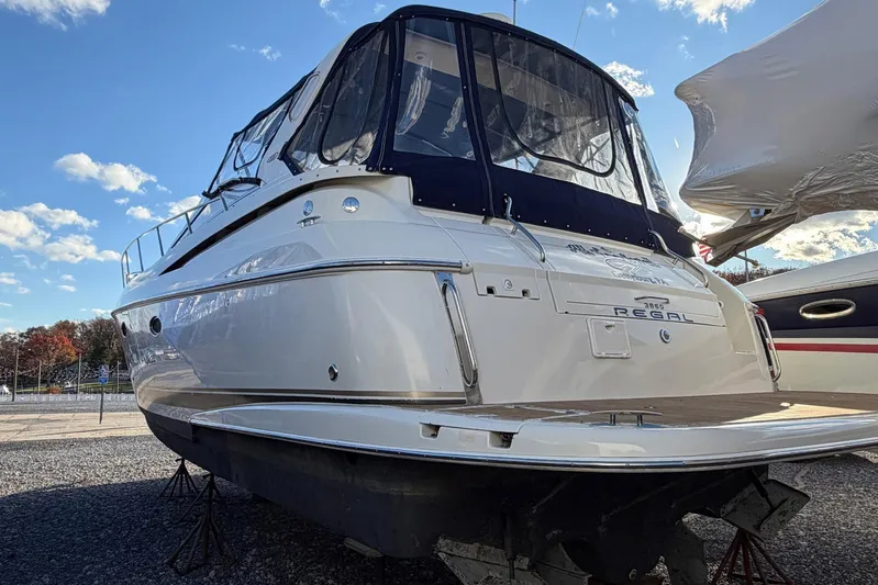 All Too Swell Yacht Photos Pics 2002 Regal Commodore 3860 yacht on display under a clear blue sky.