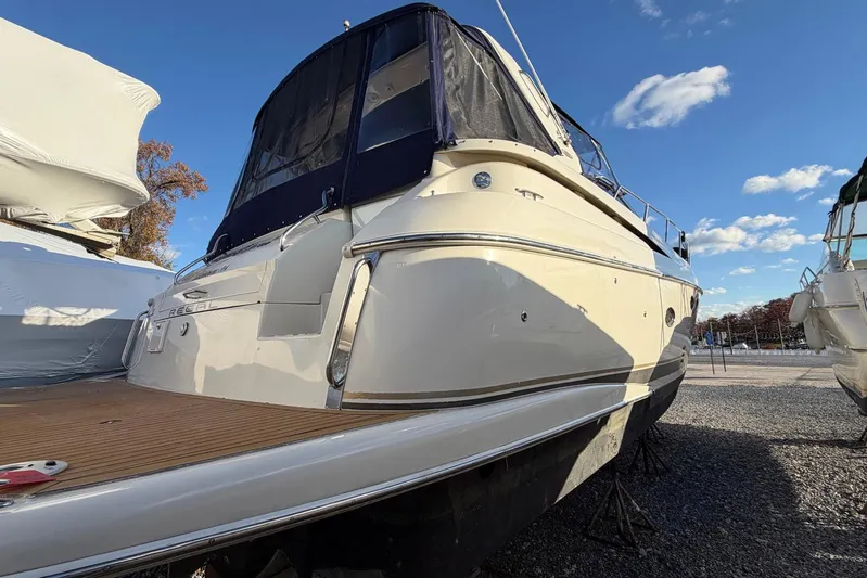 All Too Swell Yacht Photos Pics 2002 Regal Commodore 3860 yacht on dry dock under clear blue sky.