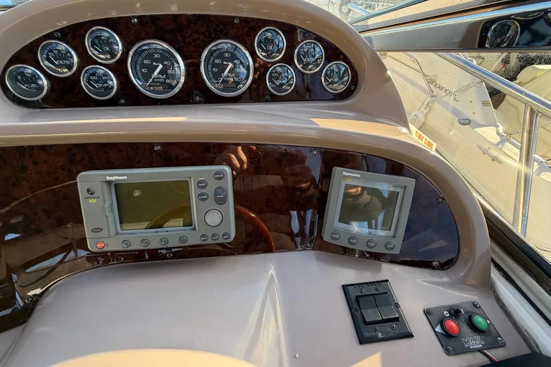 All Too Swell Yacht Photos Pics 2002 Regal Commodore 3860 dashboard with gauges and navigation equipment.
