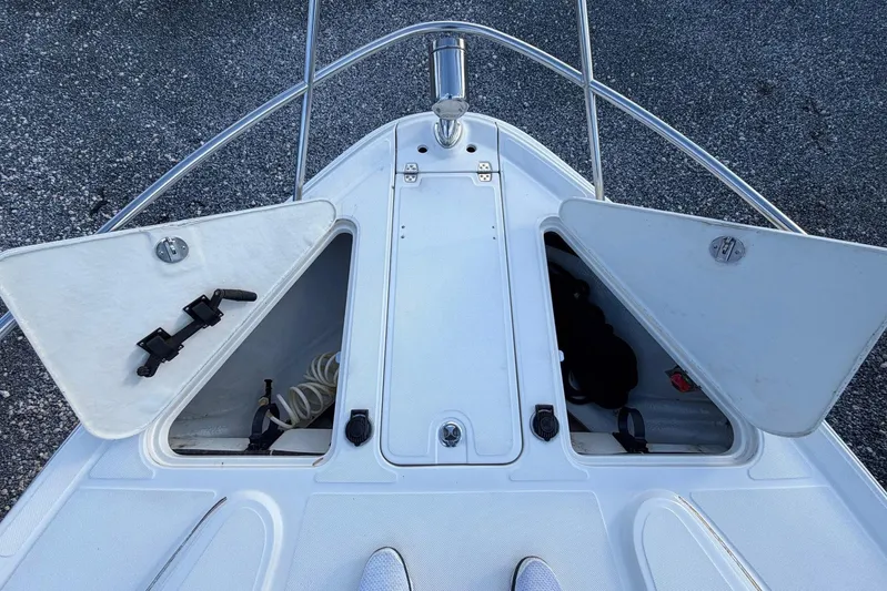 All Too Swell Yacht Photos Pics Bow storage compartments on a 2002 Regal Commodore 3860 boat, open and accessible.