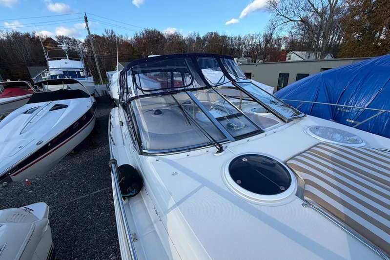 All Too Swell Yacht Photos Pics 2002 Regal Commodore 3860 yacht docked, showcasing sleek design and spacious deck.