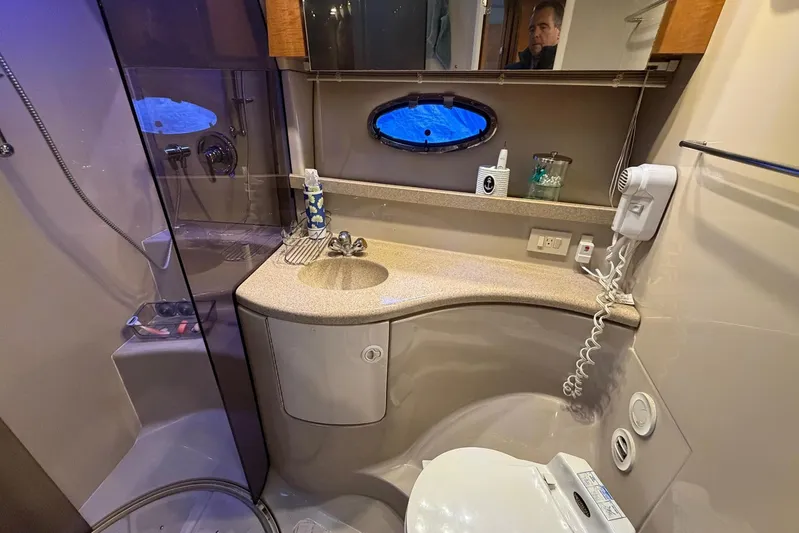 All Too Swell Yacht Photos Pics Luxurious bathroom in 2002 Regal Commodore 3860 yacht with modern amenities.