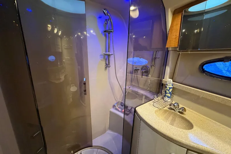 All Too Swell Yacht Photos Pics Luxurious bathroom in 2002 Regal Commodore 3860 yacht with modern fixtures and elegant design.