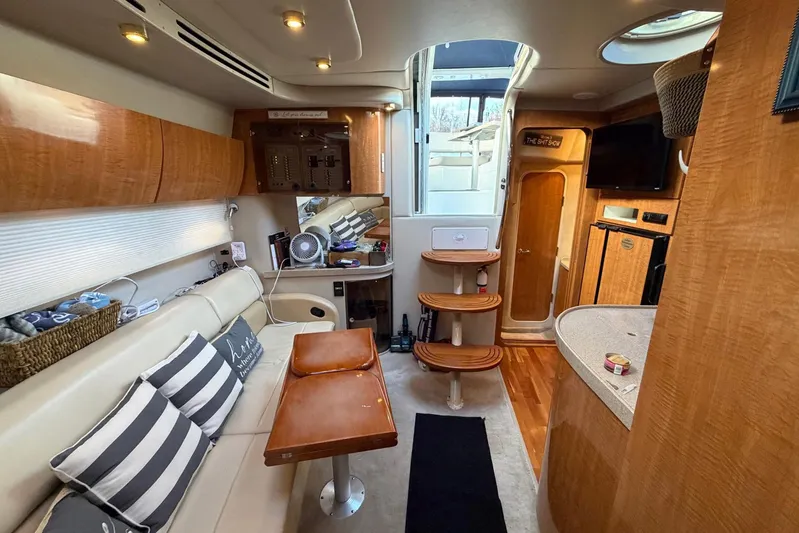 All Too Swell Yacht Photos Pics Interior of 2002 Regal Commodore 3860 yacht with modern amenities and wooden finishes.