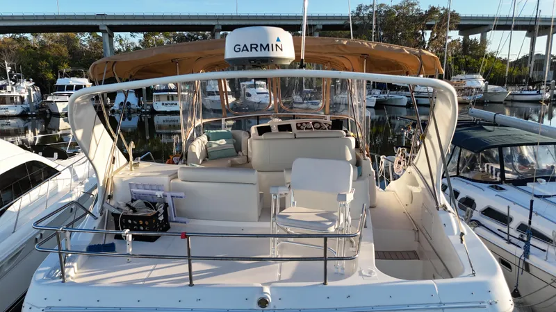  Yacht Photos Pics 2002 Silverton 410 Sport Bridge yacht docked at marina, featuring Garmin equipment.